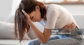 Patient discussing abdominal pain and digestive symptoms with a physician at 14 Street Medical Arts in New York City.