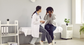 Physician evaluating a patient with persistent headaches and discussing Brain MRI at 14 Street Medical Arts