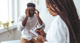 Board-certified neurologist evaluating a patient with chronic headaches and migraines at 14 Street Medical Arts