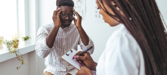 Headache & Migraine Specialist NYC Board-certified neurologist evaluating a patient with chronic headaches and migraines at 14 Street Medical Arts